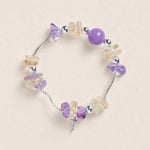 Beaded bracelet with purple and clear teardrop beads and silver spacer beads